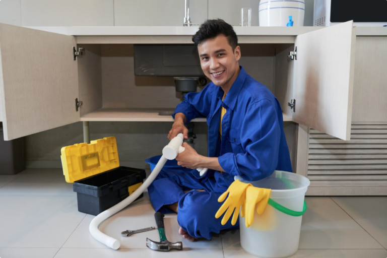 Professional plumber ensuring leak‑free bathroom